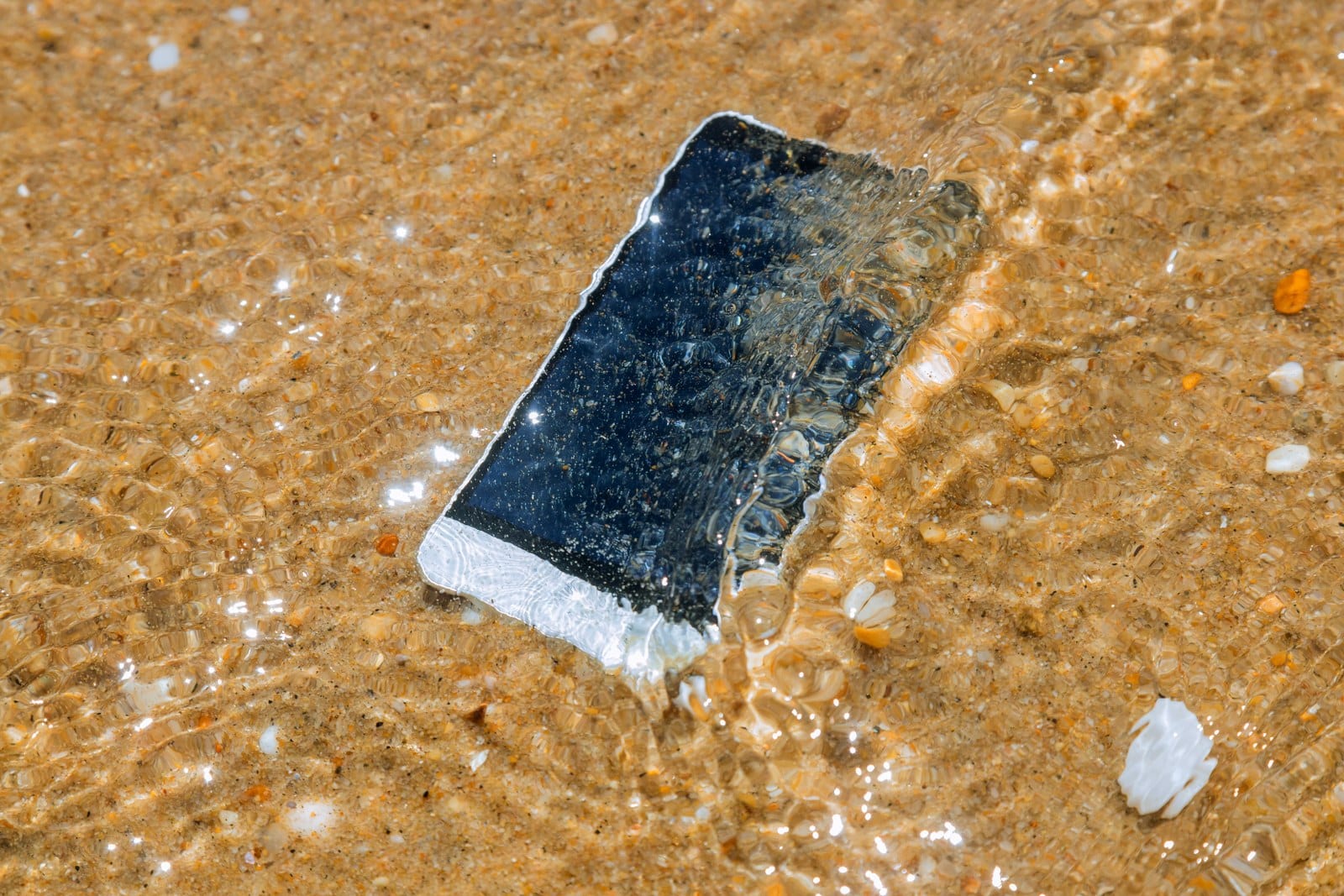 Phone Repairs Wavell Heights Phone Repairs Wavell Heights smart phone with weather on a sandy beach of sea b 2023 11 27 05 09 06 utc 1600x1067